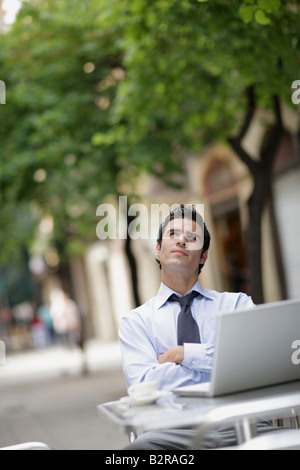 Business man at café with laptop Stock Photo