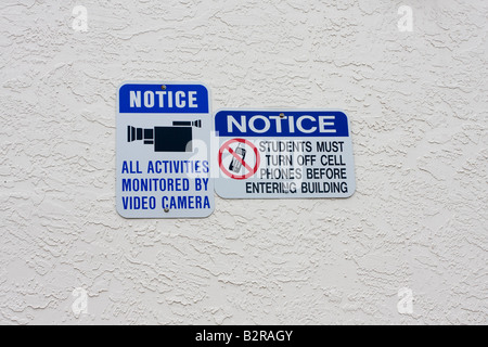 Signs Warning of Video Monitoring and that Cell Phones must be Turned Off Stock Photo