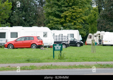 No Parking on the grass sign in front of a travellers site UK Stock Photo