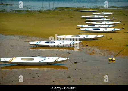 Geometry of a line of sailboats at low tide Stock Photo