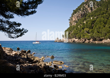 Yacht moored in the cove at Cala Tuent, Mallorca, Spain Stock Photo