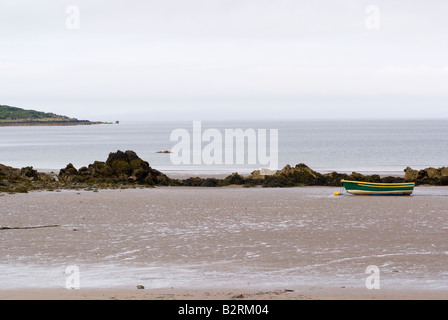 Green and Yellow Rowing Boat Moored on Sandy Beach at Carrick Islands of Fleet Wigtown Bay Dumfries and Galloway Scotland UK Stock Photo