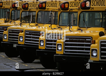 Row of yellow school buses in bus depot Stock Photo