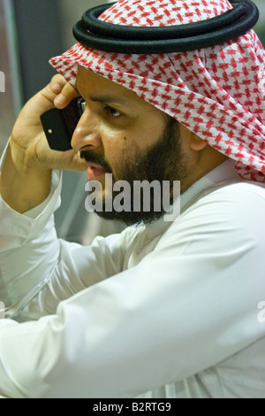 Arab Man Talking on a Cellphone in Dubai UAE Stock Photo