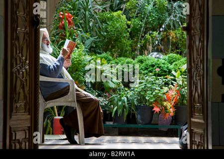 Muslim Reading the Koran in a Mosque in the Old City in Damascus Syria Stock Photo