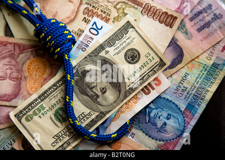 Currency notes with sterling dollar and euro tied in a noose Stock Photo