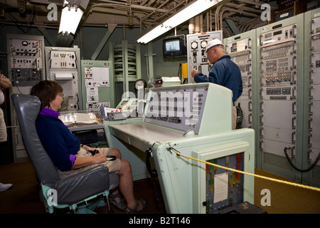 Woman sitting at mission control console Titan II Missile museum near Tucson Arizona, USA Stock Photo