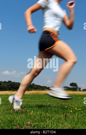 Girl running in the park Stock Photo