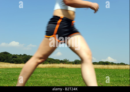 Girl jogging in the park Stock Photo