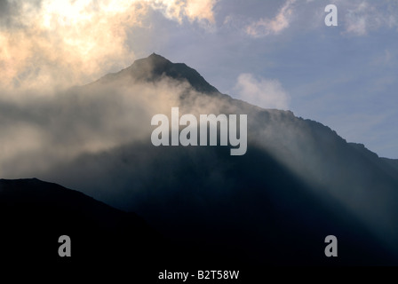 Mount Snowdon in atmospheric clouds Stock Photo