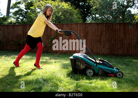 Teenage Girl Mowing the Lawn Model Released Stock Photo