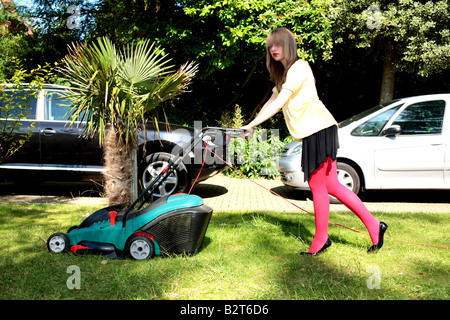Teenage Girl Mowing the Lawn Model Released Stock Photo
