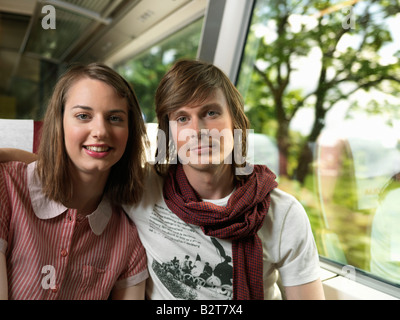 Young couple on train Stock Photo
