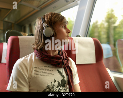 Young man on train Stock Photo