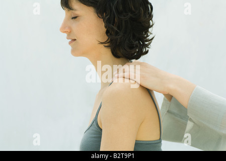 Woman receiving neck massage, side view Stock Photo