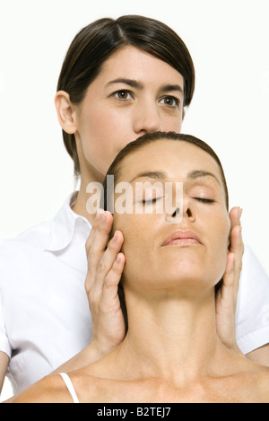 Woman receiving head massage, eyes closed Stock Photo