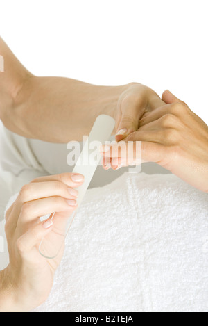 Woman receiving manicure, cropped view of hands Stock Photo