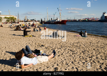 People relaxing at beach, People relaxing at Elbe beach, Oevelgoenne, Hamburg, Germany Stock Photo