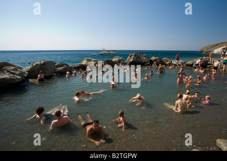 People bathing in the Embros Therme, a naturally 40 degree hot spring added with sulfit, knowing as health care, near Kos-Town, Stock Photo