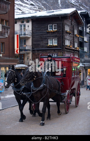 A Carriage Passing A Street In Zermatt Valais Switzerland Stock Photo 