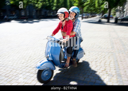 Couple on scooter Stock Photo