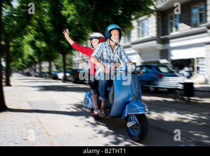 Couple on scooter Stock Photo