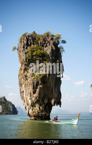 View to Koh Tapu, so-called James Bond Island, The Man with the Golden Gun, people in a longtail boat in foreground, Ko Khao Phi Stock Photo