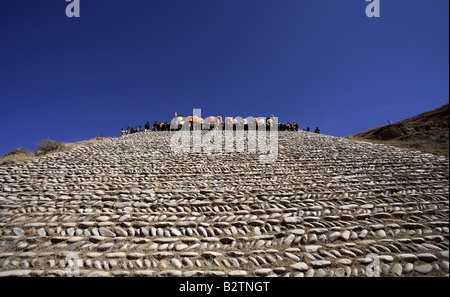 Buddhist Monks are about to enroll a huge Thangka,Tongren,Qinghai Province,China Stock Photo