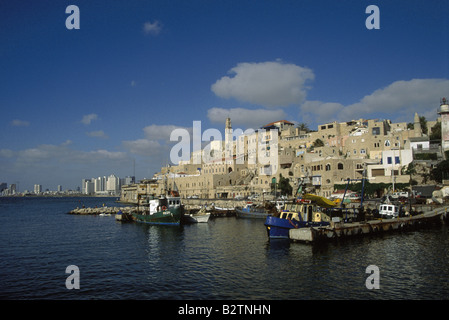 View across harbour to houses Boats moored in sea jaffa  israel