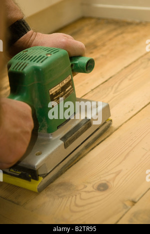 sanding floorboards Stock Photo