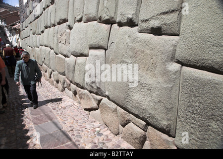 Famous 12 angled stone in Calle Hatun Rumiyoc, the most angles in an original Inca wall found in Cusco, Peru in South America. Stock Photo