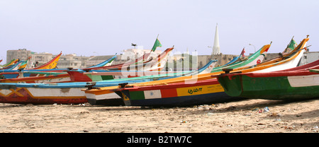 Colourful wooden fishing boats lined up on Marina Beach in Chennai, India Stock Photo