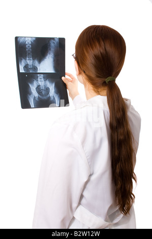 Female doctor examining a pelvis x-ray Stock Photo