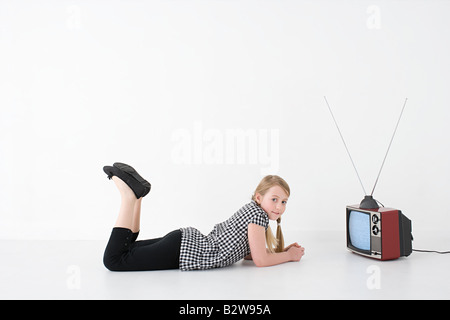 Girl with television Stock Photo