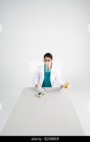 Scientist with model car Stock Photo