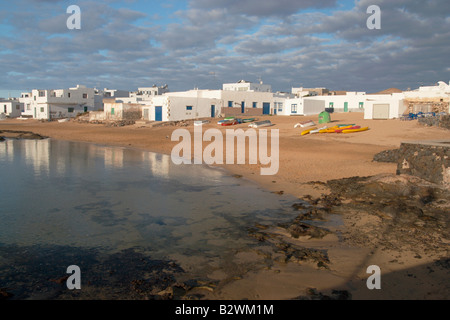 White houses and beach in Caleta del Sebo on La Graciosa island (near Lanzarote) in the Canary islands. Stock Photo