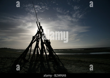 A tepee frame made out of driftwood on Farewell Spit near Puponga, Golden Bay, South Island, New Zealand Stock Photo