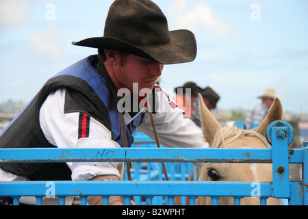 A cowboy prepares for bronc riding at a Rodeo held in Hamilton, on the North Island, New Zealand Stock Photo