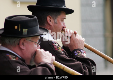Alphorn players in traditional costume during Jodlerfest in Malters, near Lucerne, Central Switzerland Stock Photo