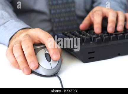 Closeup of man s hands with computer mouse and keyboard Stock Photo