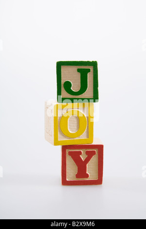 Wooden blocks spelling joy. Stock Photo