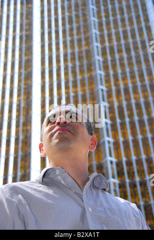 Businessman looking up with hope Stock Photo