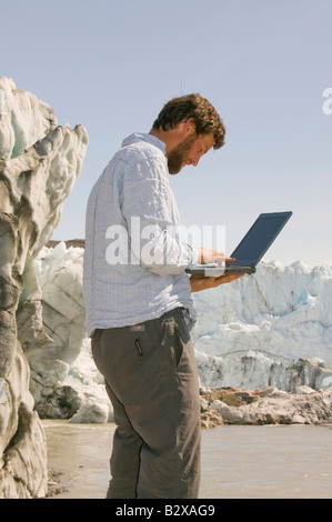 scientist working on a research project on the Russell Glacier in Greenland to study how climate change is speeding it up Stock Photo