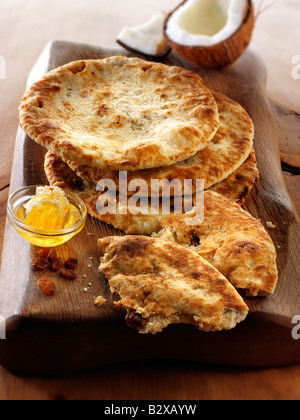 Peshwari Naan. coconut sultanas and honey Bread served ready to eat- Indian Cuisine - top shot, from above Stock Photo