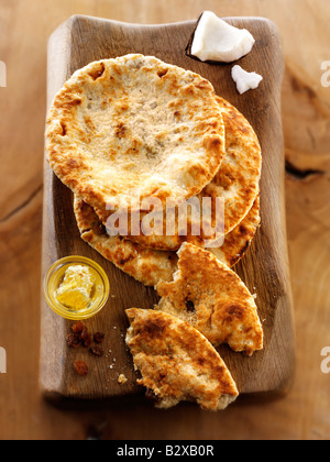 Peshwari Naan. coconut sultanas and honey Bread served ready to eat- Indian Cuisine - top shot, from above Stock Photo