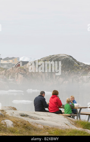 Mist over icebergs in Illulisat on Greenland Stock Photo