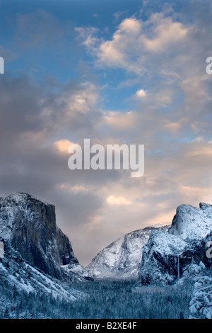 Clearing skies from a late winter snowstorm reveals a carpet of fresh snow over the Yosemite Valley Stock Photo