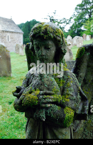 Stone angel in cemetery of St Nicholas Church, Studland, Dorset, England Stock Photo