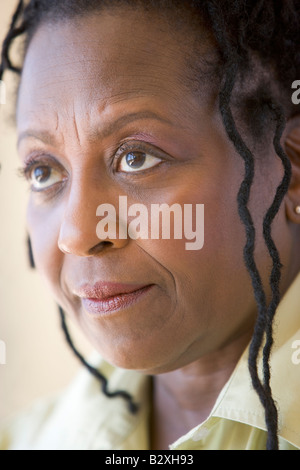 Head shot of woman scowling Stock Photo