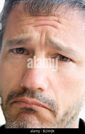 Head shot of sad man Stock Photo
